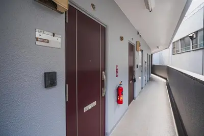 an empty hallway of a hospital with a fire extinguisher at SLL Urban Suites Shibuya in Tokyo