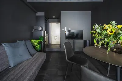 a living room with a couch and a table at SLL Urban Suites Shibuya in Tokyo