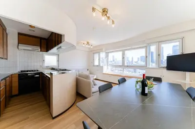 a kitchen and living room with a table in a kitchen at Vacation Stay Sanesu in Tokyo