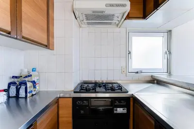 a kitchen with a stove and a counter top at Vacation Stay Sanesu in Tokyo