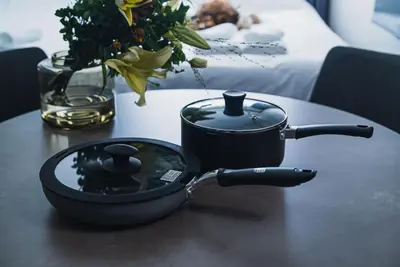 a mortar and pestle sitting on a table with a candle at SLL Urban Suites Akasaka in Tokyo