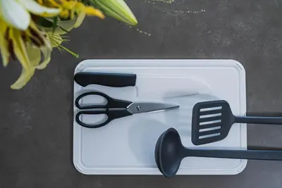 a pair of scissors in a container with flowers at SLL Urban Suites Akasaka in Tokyo