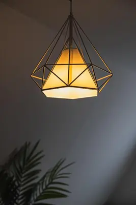 a light fixture hanging from a ceiling at SLL Urban Suites Akasaka in Tokyo