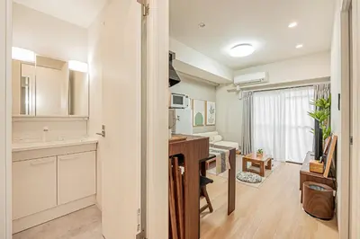 a kitchen with a sink and a desk in a room at Diamond Mansion Apartment Hotel in Tokyo