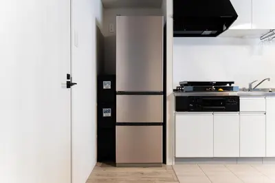 a kitchen with a refrigerator and a stove at Haneda Direct Bus 1h 2BR 2LDK Luxury Mattress in Tokyo