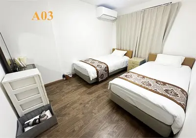a room with two beds in a hotel room at Tabata Flower Village - Vacation STAY 45880v in Tokyo