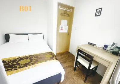 a small bedroom with a bed and a desk at Tabata Flower Village - Vacation STAY 45912v in Tokyo