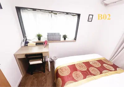 a bedroom with a desk and a bed and a window at Tabata Flower Village - Vacation STAY 45922v in Tokyo