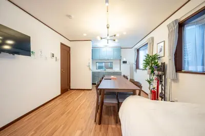 a living room with a table and a couch at FAMILIA KAMTA 1 - Vacation STAY 20525 in Tokyo