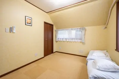 a room with two beds and a window at FAMILIA KAMTA 1 - Vacation STAY 20525 in Tokyo