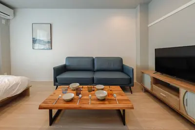a living room with a couch and a coffee table at AI Grandir Azumabashi 1F - Vacation STAY 73817v in Tokyo