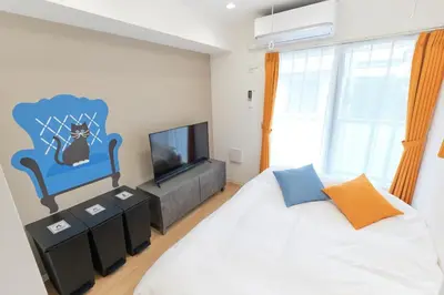 a bedroom with a bed and a tv at Gaia Bosco - Vacation STAY 76623v in Tokyo