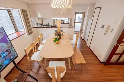 a kitchen and dining room with a table and chairs at Mi-APT Kitashinjuku in Tokyo