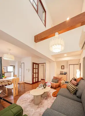 a living room with a couch and a table at Mi-APT Kitashinjuku in Tokyo