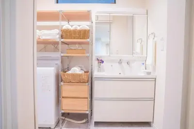 a white bathroom with a sink and a mirror at HoshiyoriTokyo in Tokyo