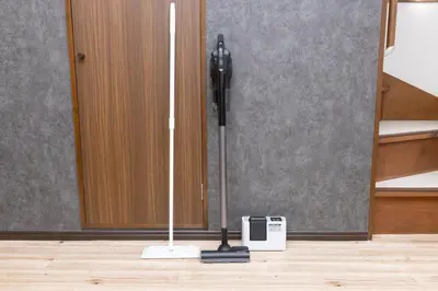 a mop on the floor in front of a door at Karabiner House Ikebukuro in Tokyo