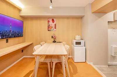 a dining room with a wooden table and chairs at Komorebi Asakusa 202 Cozy 6P Stay The 77 House Tokyo in Tokyo