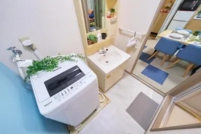 a bathroom with a sink and a toilet in a room at Shamrock Aoto 302 Cozy Tokyo Stay Near Station Airport Disney Access in Tokyo