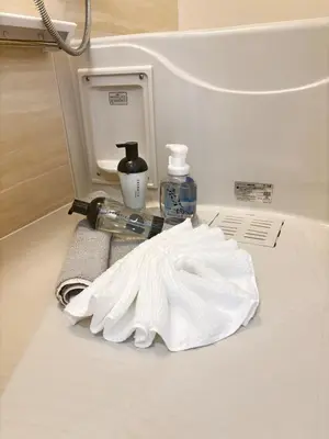 a bathroom counter with a towel and a sink at Yui Rin Asakusa 902 in Tokyo