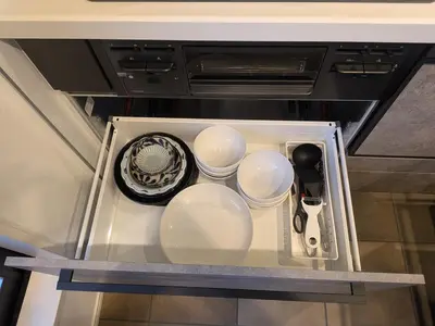 a refrigerator filled with dishes and utensils at \u65b0\u5bbf\u306e\u4e00\u8ed2\u5bb6 \u725b\u8fbc\u67f3\u753a\u99c5\u5f92\u6b694\u5206 70\u5e73\u7c73 3\u5bdd\u5ba4 5\u30d9\u30c3\u30c9 7\u4eba\u307e\u3067\u5bbf\u6cca\u53ef in Tokyo