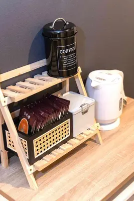 a coffee maker sitting on top of a wooden shelf at StylishApartment 4Bds5p SkyTree5m Asakusa9m in Tokyo