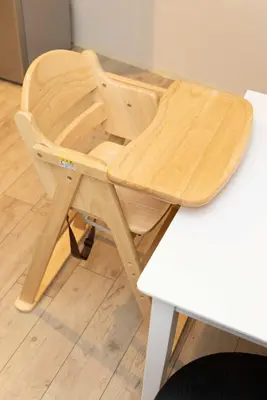 a wooden chair sitting next to a white table at StylishApartment 4Bds5p SkyTree5m Asakusa9m in Tokyo