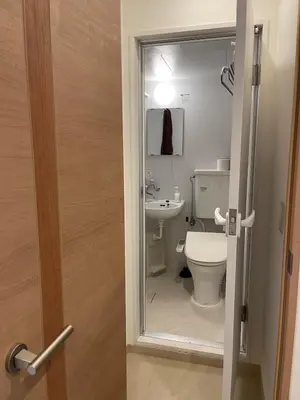 a bathroom with a toilet and a sink at Shin-Okubo, Shinjuku's best central location, private bathroom and toilet in Tokyo