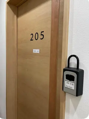 a wooden door with a lock on it at Shin-Okubo, Shinjuku's best central location, private bathroom and toilet in Tokyo