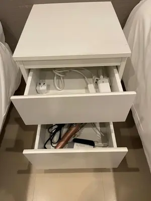a white nightstand with a white drawer with controllers at Shin-Okubo, Shinjuku's best central location, private bathroom and toilet in Tokyo