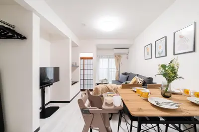 a kitchen and living room with a table and chairs at 3-chome House Senju - Entire Private Home - Direct Access to Ueno & Asakusa in Tokyo
