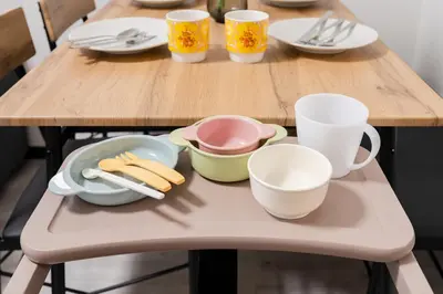 a table with plates and cups and utensils on it at 3-chome House Senju - Entire Private Home - Direct Access to Ueno & Asakusa in Tokyo