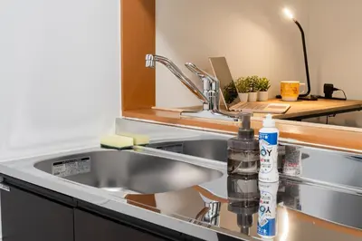 a kitchen sink with a bottle of dish detergent on it at 3-chome House Senju - Entire Private Home - Direct Access to Ueno & Asakusa in Tokyo