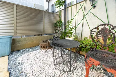 a patio with a table and chairs and a fence at 7-minute walk from Otsuka Station,Yamanote Line 3-person Shared garden in Tokyo