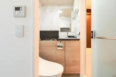 a small bathroom with a toilet and a sink at monthly HJ PLACE TAKANAWA in Tokyo
