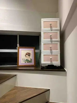 a room with a shelf with drawers and a picture at Spacious 3BR house 6 mins to JR Koiwa Station in Tokyo