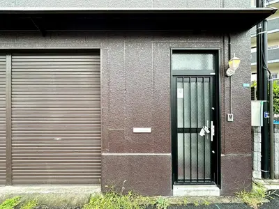 a pair of garage doors and a black door at Spacious 3BR house 6 mins to JR Koiwa Station in Tokyo