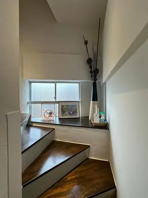a room with stairs with a window and a table at Spacious 3BR house 6 mins to JR Koiwa Station in Tokyo