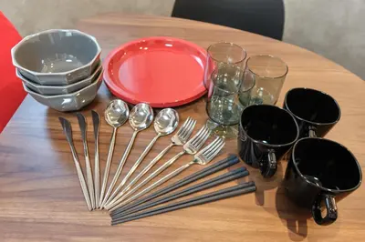 a table with plates and forks and glasses on it at monthly J-ARC\u65b0\u5bbf in Tokyo