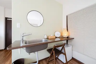a bathroom with a sink and a mirror at KOTOBUKI House - Perfect for Groups - 3 Bedrooms, 3 Baths in Tokyo