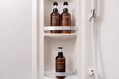 a cupboard with two shampoo bottles in it at KOTOBUKI House - Perfect for Groups - 3 Bedrooms, 3 Baths in Tokyo