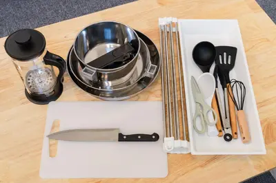 a table with utensils on a cutting board at KOTOBUKI House - Perfect for Groups - 3 Bedrooms, 3 Baths in Tokyo