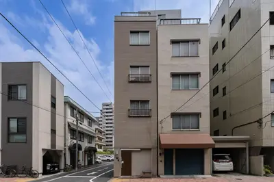 an external view of a building on a street at KOTOBUKI House - Perfect for Groups - 3 Bedrooms, 3 Baths in Tokyo
