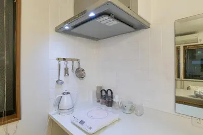 a kitchen with a sink with a mixer on a counter at Yotsuya Lantern - Private 3 stories house for family in Tokyo