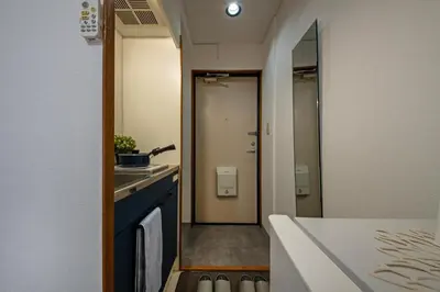 a bathroom with a sink and a mirror in a room at CraftFlat Numabukuro 306, uphill residence in Tokyo