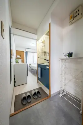 a room with a kitchen with a sink and a mirror at CraftFlat Numabukuro 306, uphill residence in Tokyo