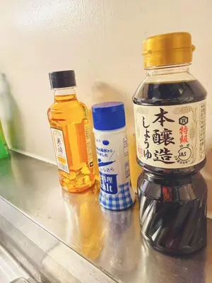 three bottles of honey and a bottle of medicine on a counter at Shinjuku Downtown\u65b0\u5bbf in Tokyo