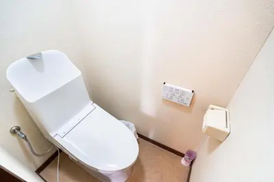 a bathroom with a white toilet in a stall at 202 Room, a 6-minute walk from Tokyo Koiwa Station Direct connected to Shinjuku and Akihabara Stations Comfortable one-bedroom apartment with separate wet and dry areas in Tokyo