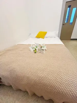 a bed with flowers sitting on top of it at Asakusa Sakura-F2 in Tokyo