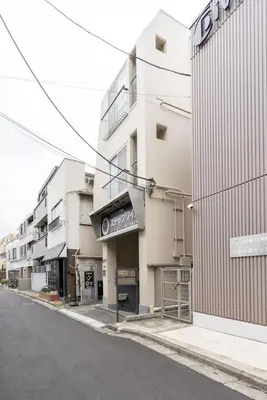an empty street in front of a building at \u30a2\u30f3\u30c9\u30b9\u30c6\u30a4\u6c38\u798f3\u4e01\u76ee202 in Tokyo