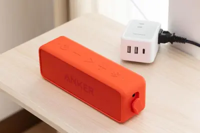 an orange modem sitting on top of a table at \u30a2\u30f3\u30c9\u30b9\u30c6\u30a4\u6c38\u798f3\u4e01\u76ee301 in Tokyo